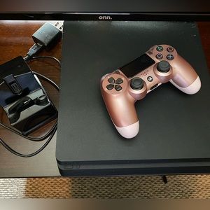 PlayStation 4 console, one controller,  and charging station